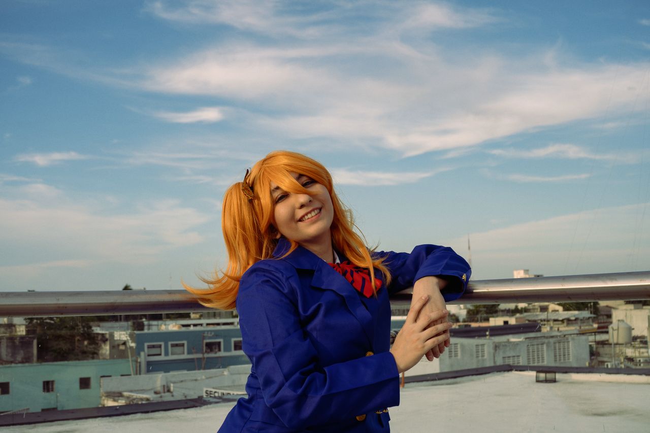 fashion portrait of a woman in cosplay with blue skies set on a urban