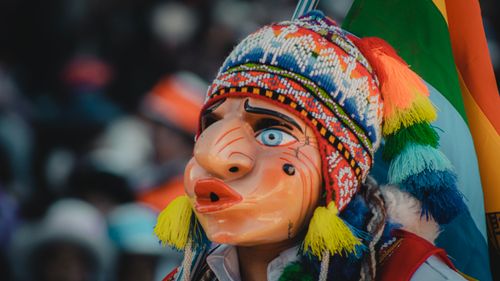 Free Close-up of a vibrant traditional mask during a cultural festival in Cusco, Peru. Stock Photo