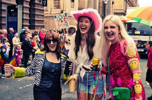 Free Happy participants celebrating at Manchester Pride Parade, showcasing colorful attire and joyful expressions. Stock Photo