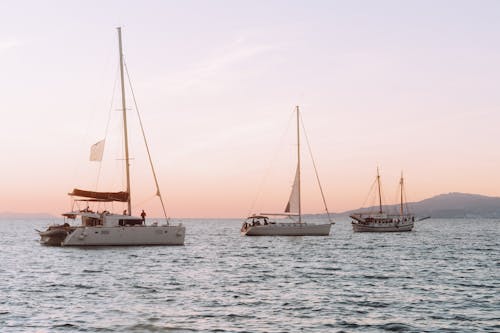 Sailboats on Sea Coast at Sunset