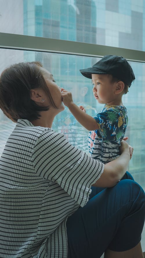 Mother with Son by Window