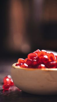 A close-up view of fresh pomegranate seeds in a bowl, offering a vibrant and healthy snack option.