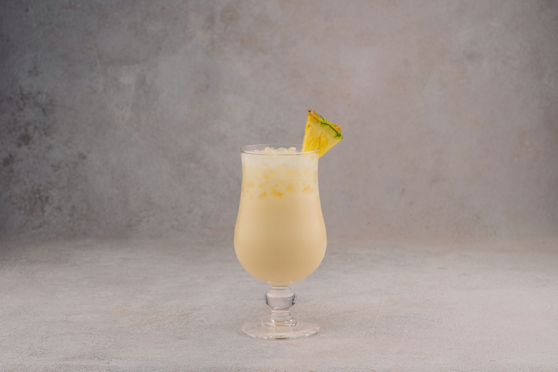 Pitcher of refreshing Coconut Rum Punch with fruit garnish