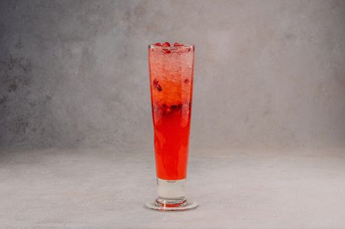 Free Chilled red berry soda in a tall glass perfect for refreshing moments. Studio shot with a simple backdrop. Stock Photo