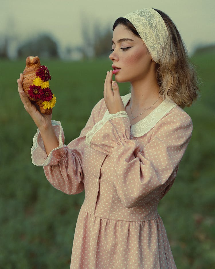 Woman With Croissant With Flowers