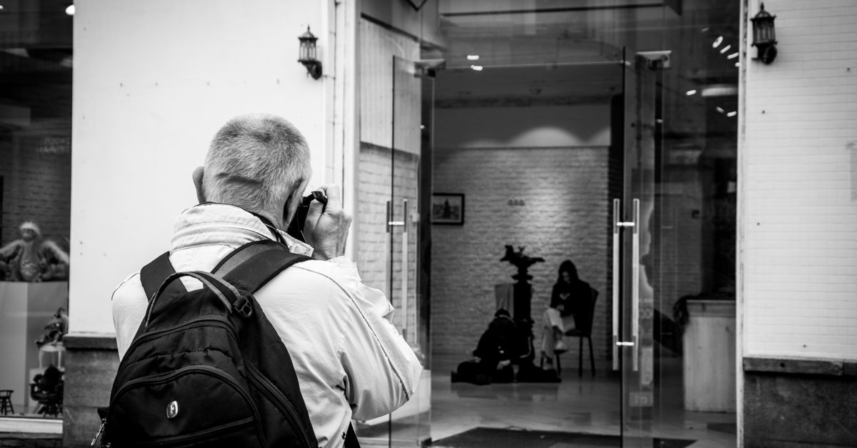 Photographer Back Back View of Photographer Taking Pictures · Free Stock Photo