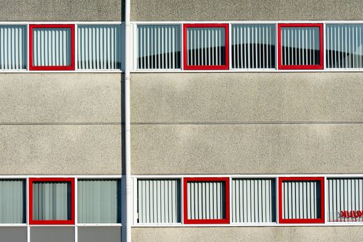 A building with red windows and white trim