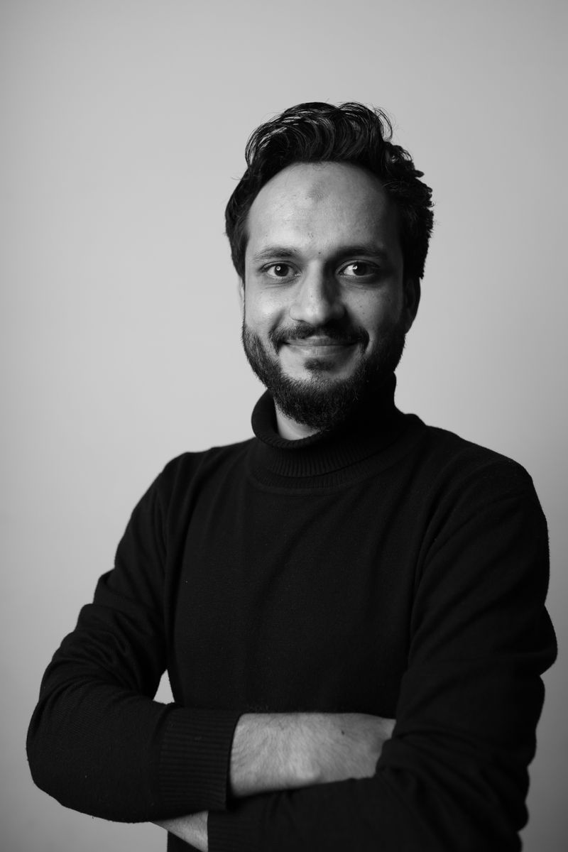 Confident professional with arms crossed, representing a demo Europe work journey