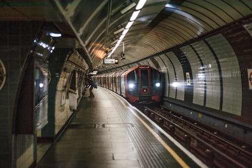 Free Train Moving in an Underground Train Station Stock Photo