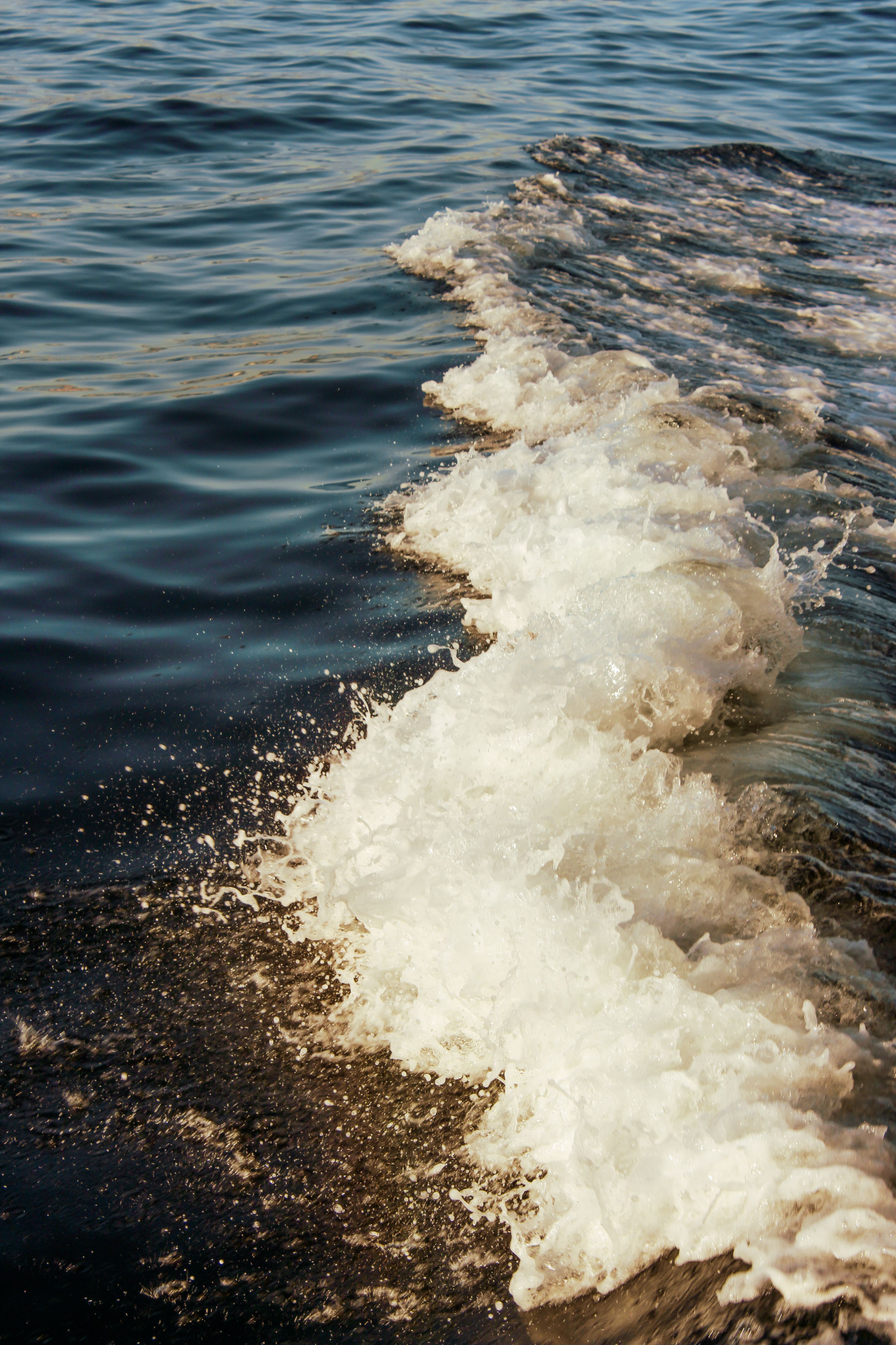 Capture of ocean waves splashing on a clear sunny day, showcasing the beauty of the sea.