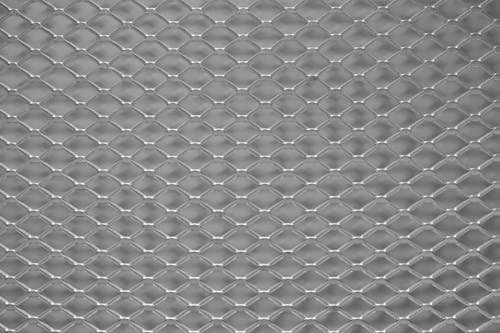 A metal mesh with a pattern of diamond shapes