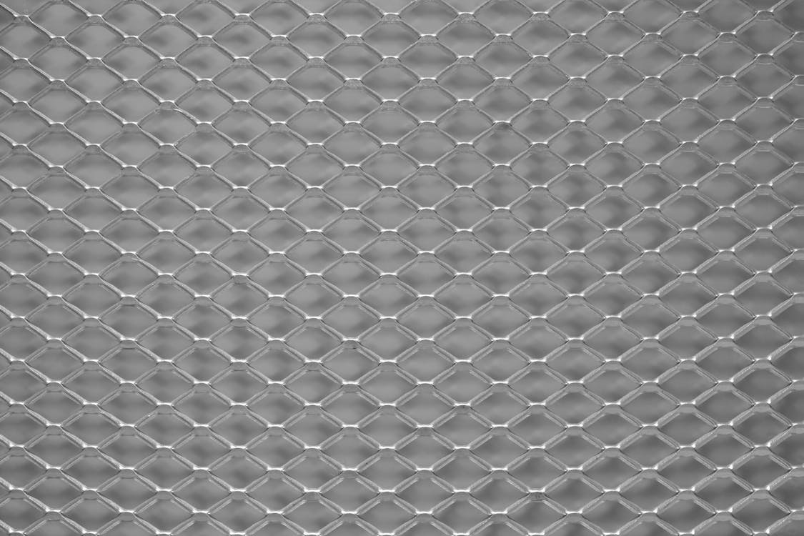 A metal mesh with a pattern of diamond shapes
