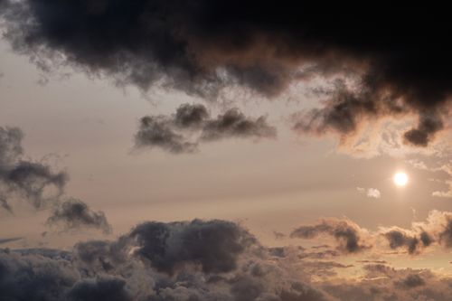 Free A dramatic cloudy sky with sunlight breaking through in Penrith, UK. Captivating weather scene. Stock Photo