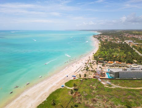 Stunning aerial view of Antunes Beach showcasing turquoise waters and lush greenery.