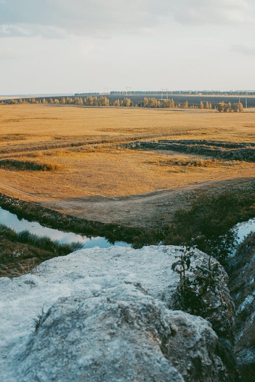 Rock over Stream and Field behind