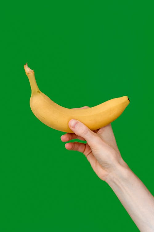 Person Holding a Banana 