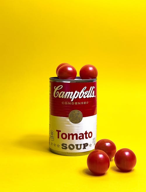 Campbell's tomato soup on a yellow background