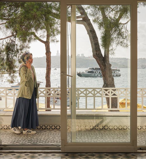 Woman Talking on Phone on Sea Coast in Istanbul