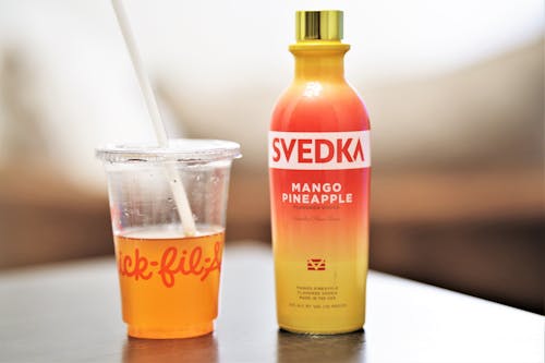 Mango Pineapple Vodka in Disposable Cup and Bottle