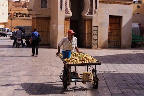 Street Fruit Vendor Walking with Trailer
