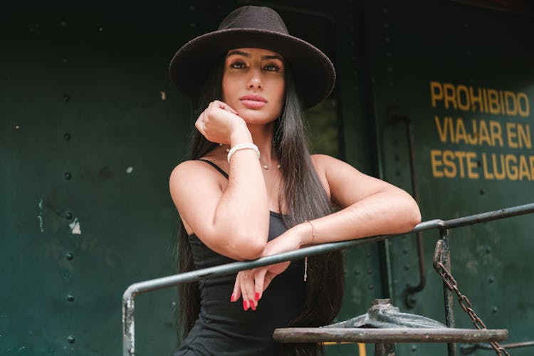 Portrait Of Woman Wearing Black Dress And Hat