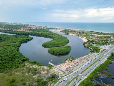 A breathtaking aerial shot of Fortaleza's coastline featuring lush greenery and winding waters.