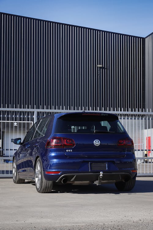 Volkswagen Golf GTI near Warehouse Building