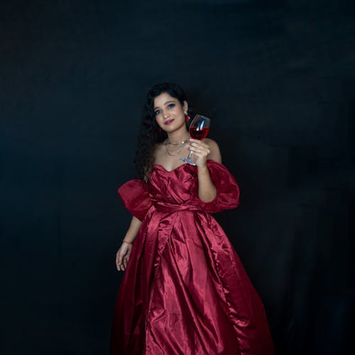 Woman in Red Dress and with Drink