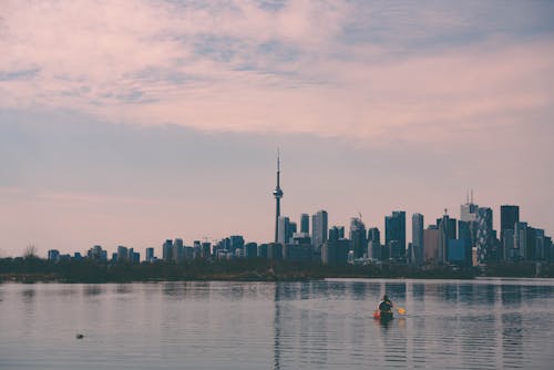 Canoeing on Lake with Toronto Skyscrapers behind