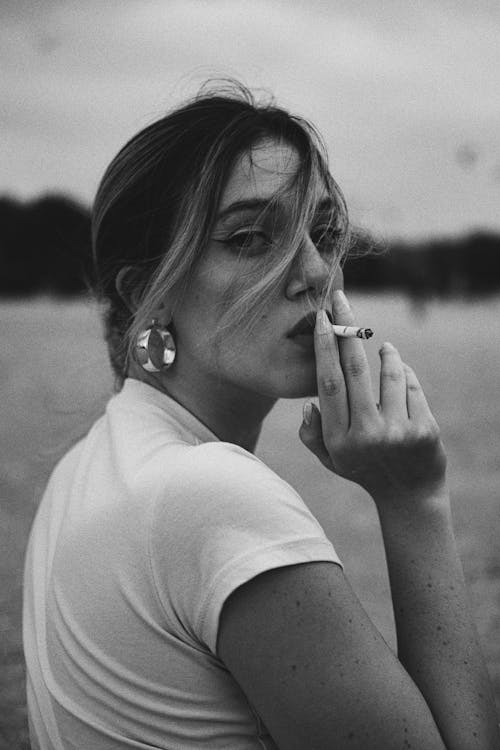 Woman Smoking Cigarette in Black and White