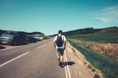 Man Walking Along the Road