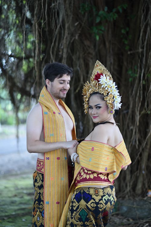 Smiling Couple in Traditional Clothing