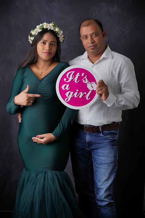 Man and Pregnant Woman in Dress