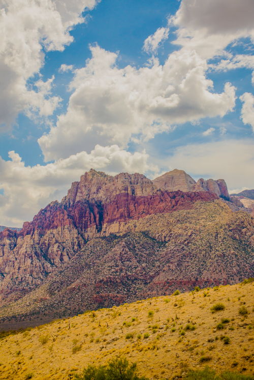 Free A stunning vertical view of Red Rock Canyon with dramatic clouds above. Stock Photo