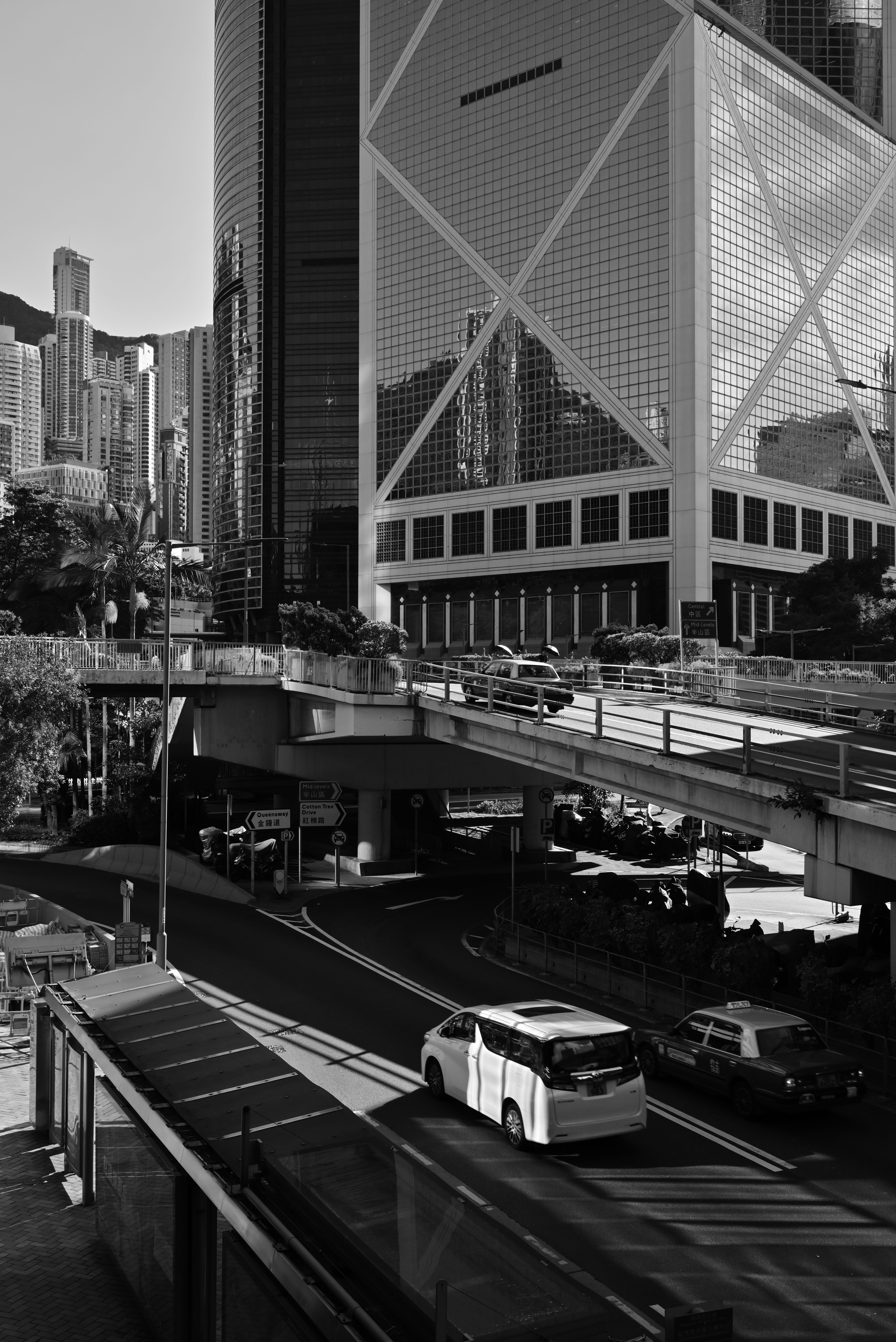 Black and white cityscape featuring modern architecture and urban streets.