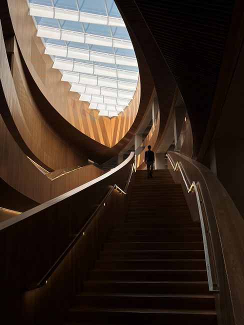 Explore the modern architecture of Calgary's library with its distinctive glass ceiling and dramatic staircase.