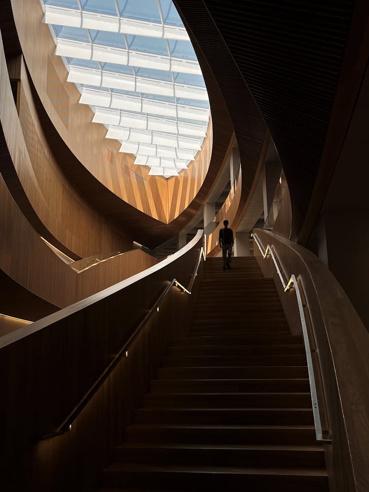 Man On Stairs At Calgary Library