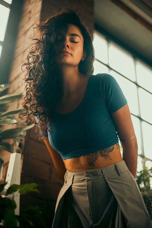 Brunette Woman Standing with Eyes Closed