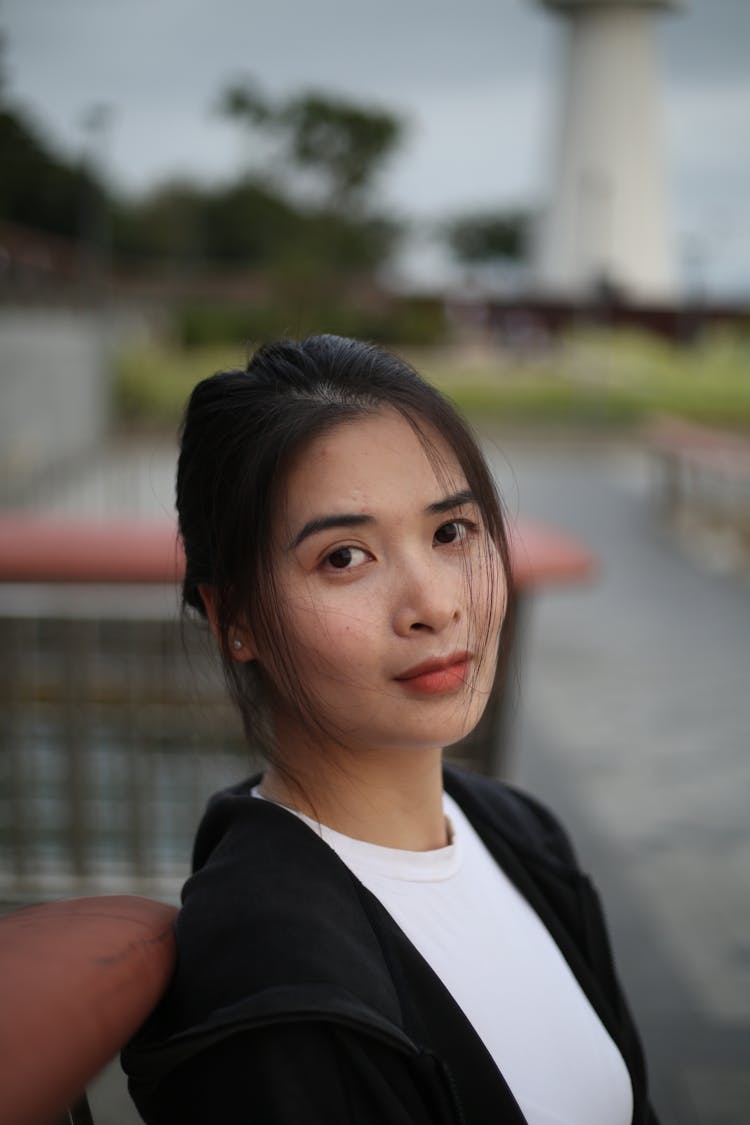 Portrait Of A Young Woman Standing Outside 