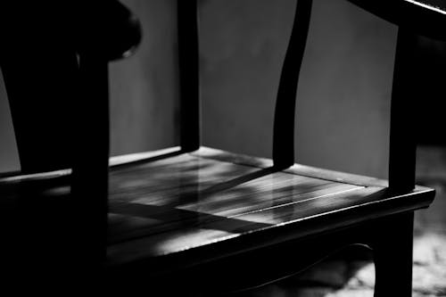 Black and White Picture of a Wooden Chair 