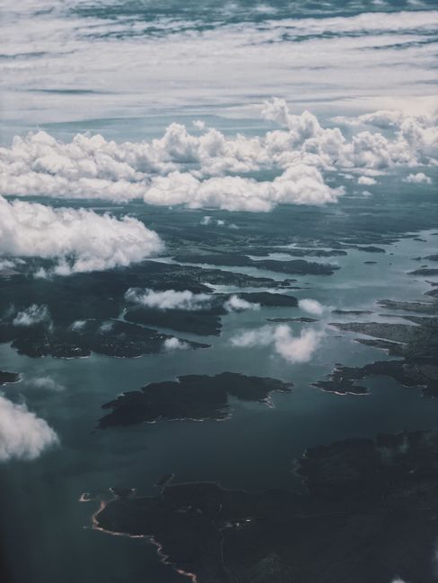 Breathtaking aerial photo capturing clouds and water bodies from above, showcasing nature's beauty.