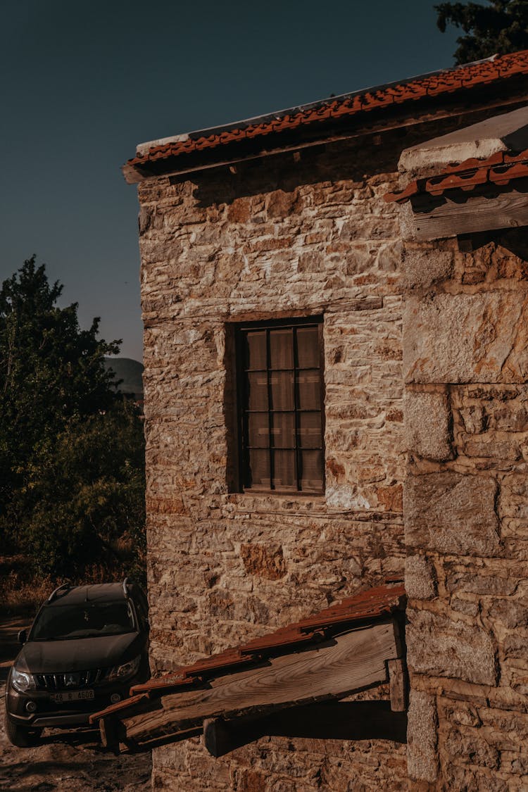 Sunlit Stone Wall Of House