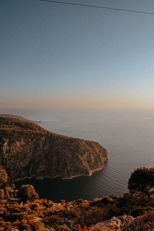Free Breathtaking aerial view of cliffs and sea at sunset near Butterfly Valley, Turkey. Stock Photo