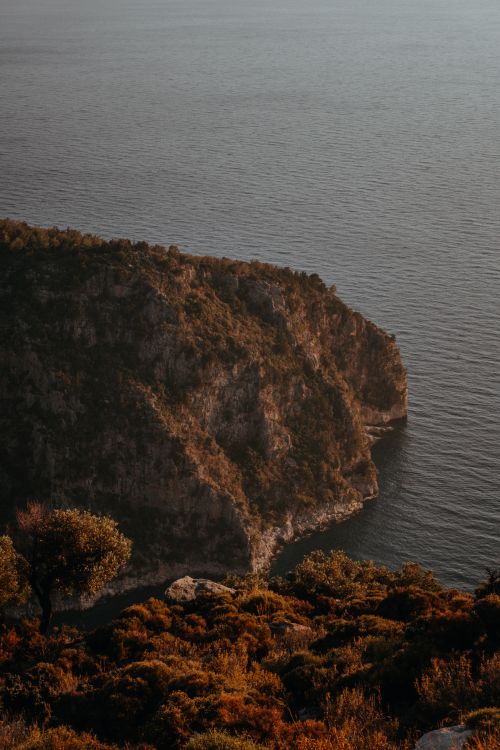 Free A picturesque view of the cliffs and sea at Butterfly Valley in Muğla, Turkey. Stock Photo