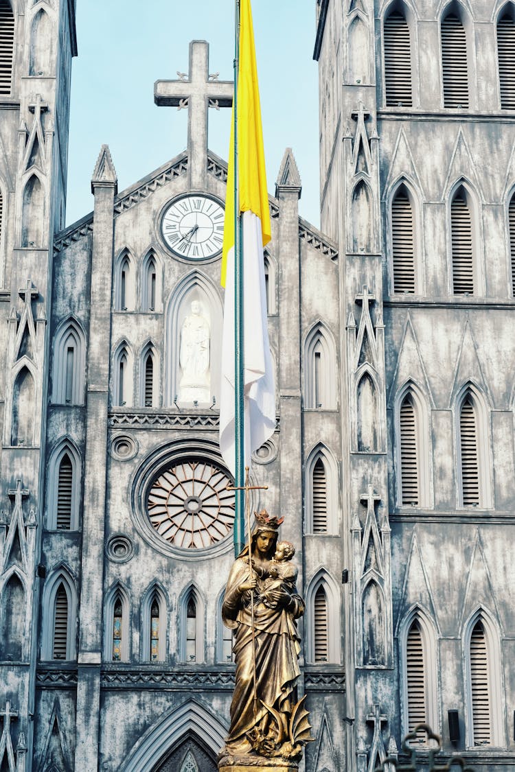 Sculpture And St Josephs Cathedral In Hanoi Behind