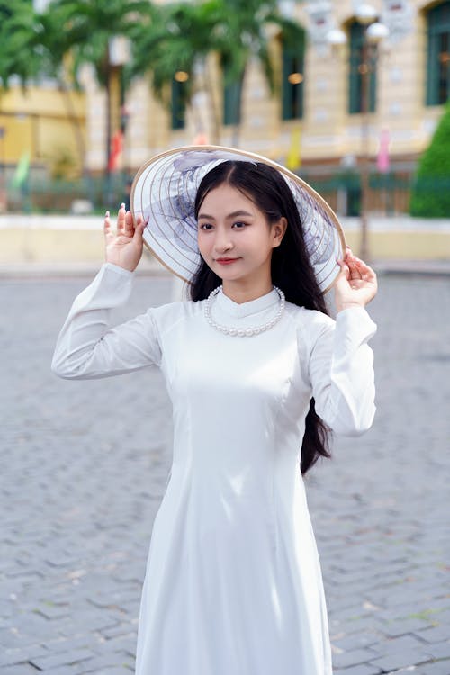 Woman in White, Traditional Clothing and Conical Hat