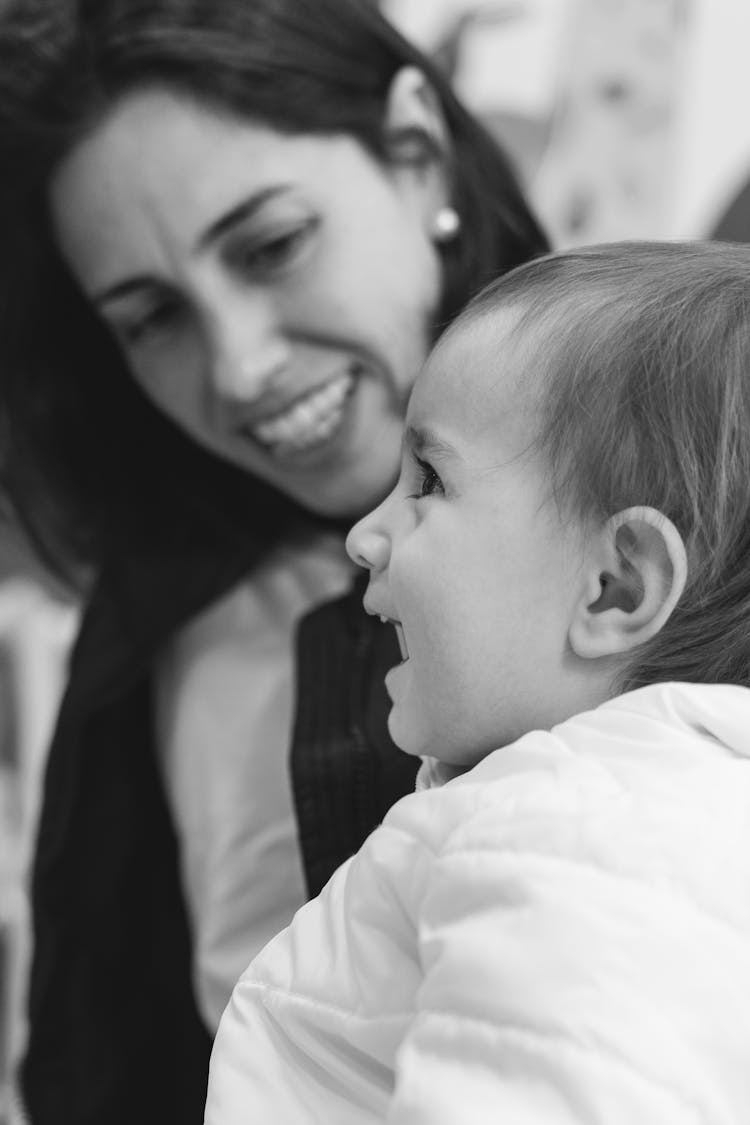 Smiling Mother And Baby Daughter In Black And White