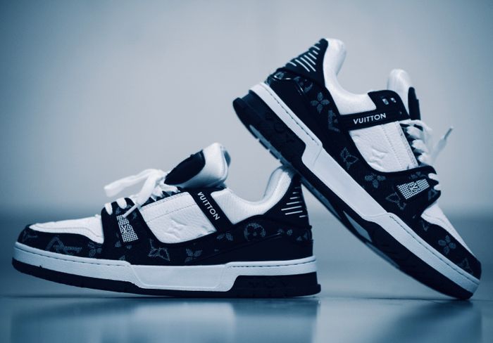 Black and white sneakers photographed by Ashis Sarker on Pexels