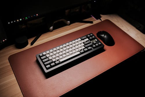 Free Mechanical Keyboard on Brown Desk Mat Stock Photo