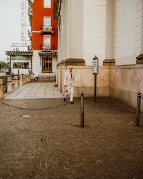 Elegant street view in Stresa highlighting Hotel Milan's classic charm and urban life.